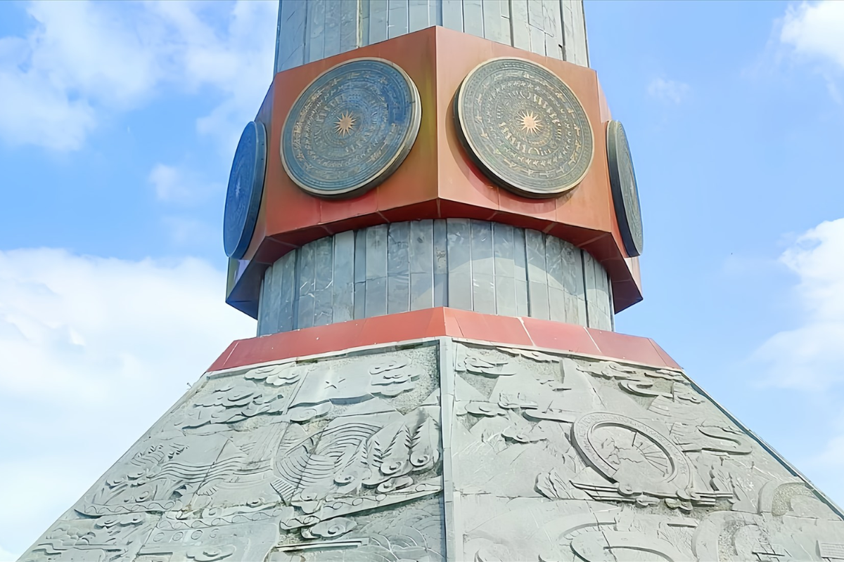 Dong Son bronze drum-inspired reliefs on Lung Cu Flag Tower pedestal